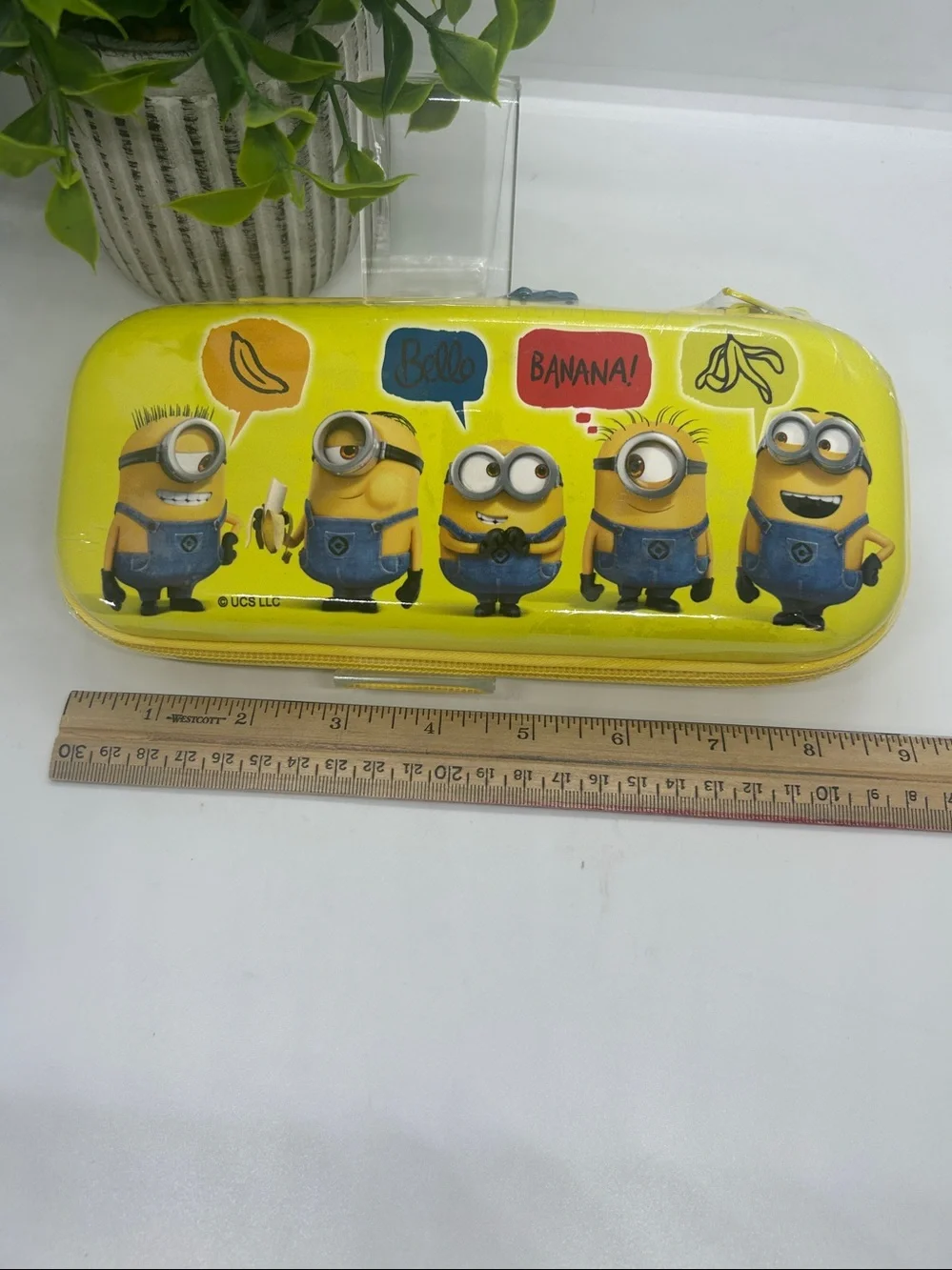 Yellow Minions character zippered pencil case graphics of various Minions.NWT
